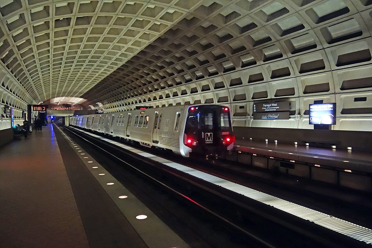 An out of service train bypassing the westbound platform of the Farragut West Metro station, underneath Farragut Square at I Street and 17th Street in Downtown Washington, D.C. Looking from the eastbound platform.