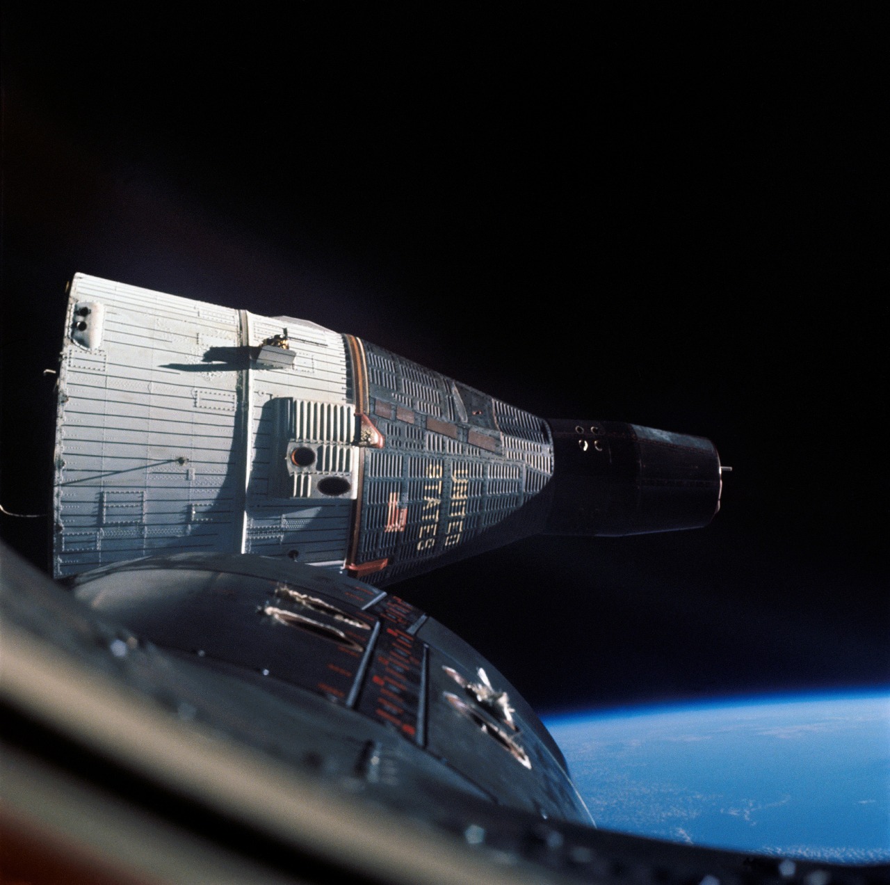 This photograph of the Gemini 7 spacecraft was taken from Gemini 6 during rendezvous and station keeping maneuvers at an altitude of approximately 160 miles above the Earth. Gemini 6 and Gemini 7 launched on December 15, 1965 and December 4, 1965, respectively. Walter M. Schirra, Jr. and Thomas P. Stafford on Gemini 6 and Frank Borman and James A. Lovell on Gemini 7 practiced rendezvous and station keeping together for one day in orbit.