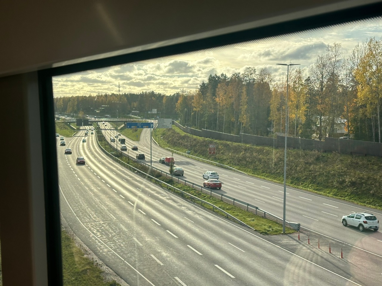 View of the Ring I road through the window of a light rail line 15 train