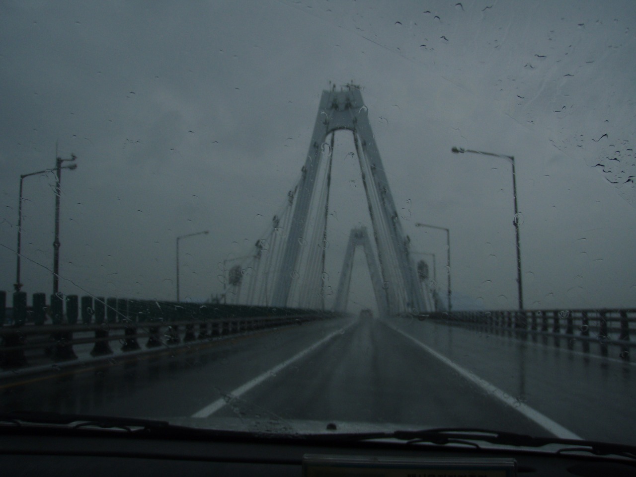 Looking west on Yeongjong Bridge on a rainy day. Located near Seoul, South Korea, this is the bridge that is used to travel to Incheon International Airport. Picture taken on August 12, 2007 by User:NHRHS2010 A smaller digitally retouched version is Image:Yeongjong Bridge small.jpg