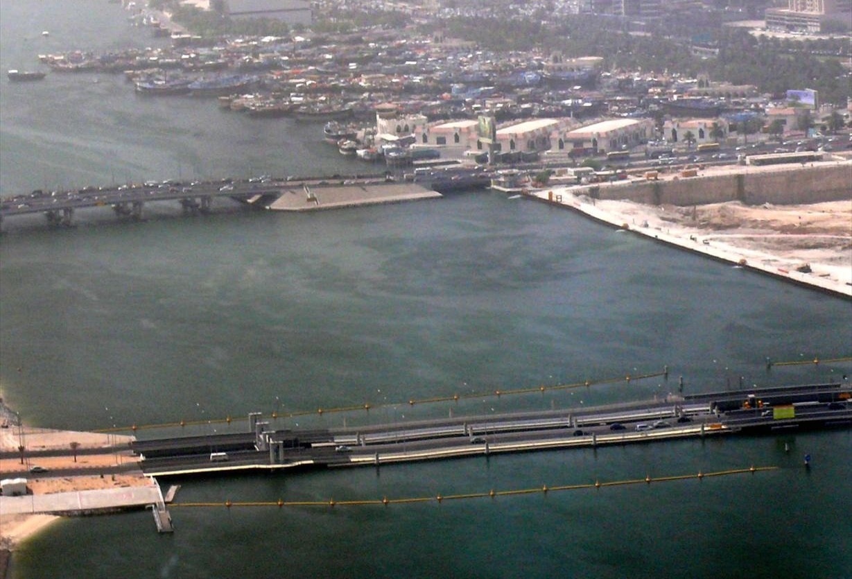 This is an aerial view of Al Maktoum Bridge (top) and Floating Bridge (bottom) over Dubai Creek in Dubai, United Arab Emirates on 8 May 2008. Deira is on the right and Bur Dubai is on the left. Port Saeed can be seen at the top of the image. This image was taken from a helicopter ride courtesy of Nakheel.