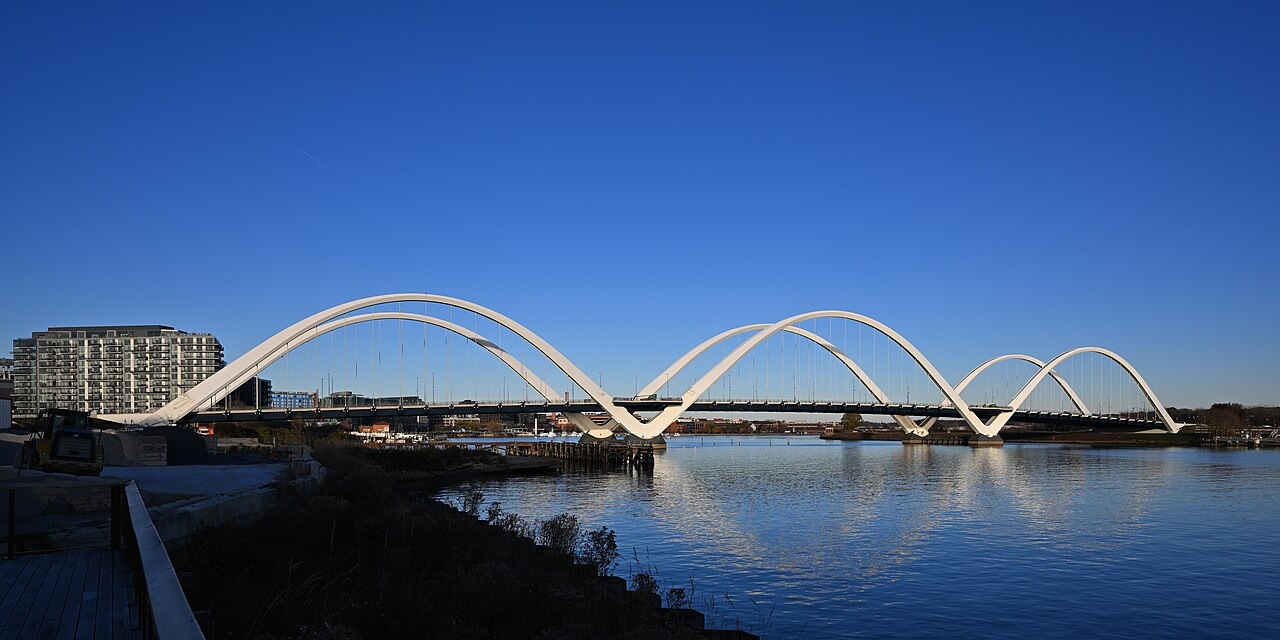 The view of the Frederick Douglass Memorial Bridge and the Anacostia River as seen from the southwest. This through arch bridge carries South Capitol St SE across the Anacostia River in Washington, DC.