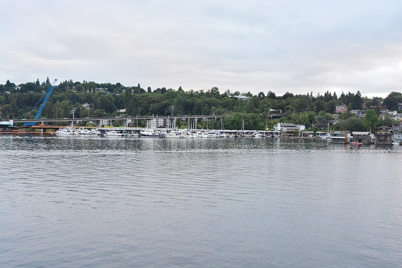 Washington State Route 520 bridge across Portage Bay and Queen City Yacht Club, Seattle, Washington. Taken from a boat, early evening.